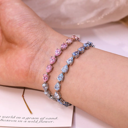 Blue gradient tennis bracelet with pear cut zirconia gemstones in sterling silver