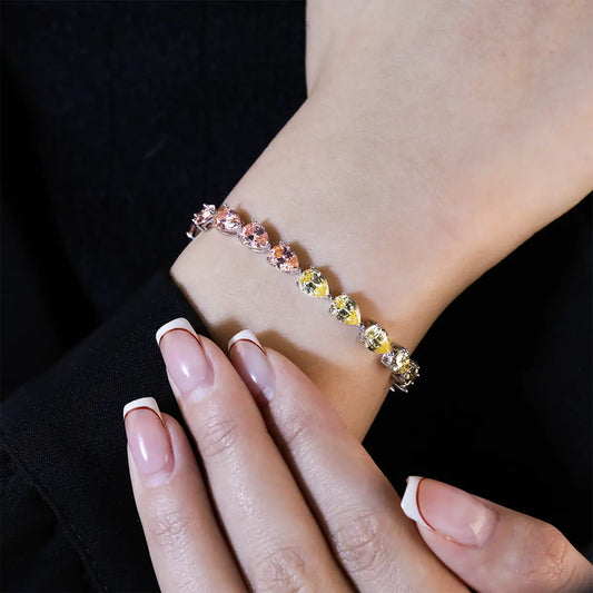 Modern sterling silver tennis bracelet with pear cut multicolor zirconia gems