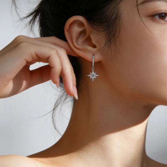 Pavé moon and star asymmetric drop hoop earrings, 925 sterling silver with 18K white gold plating, featuring 38 moissanite stones.