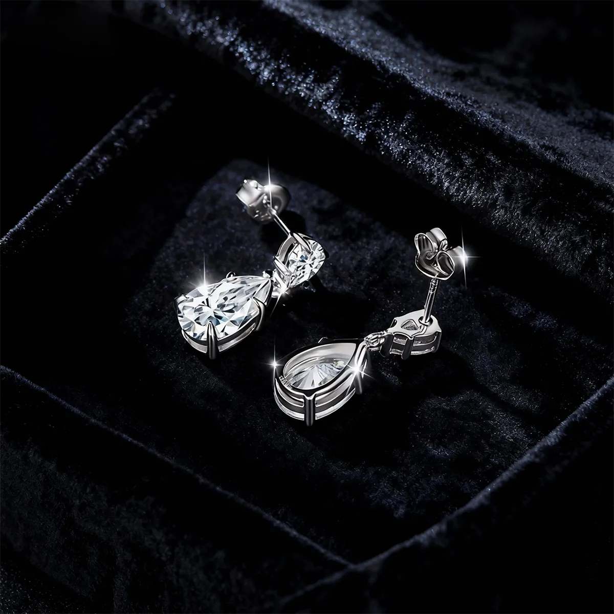 Double teardrop 11×7mm pear-cut moissanite drop earrings, 925 sterling silver with 18K white gold plating.