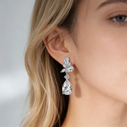Vintage leaf and teardrop statement earrings with 11×7mm pear-cut moissanite, 925 sterling silver with 18K white gold plating.