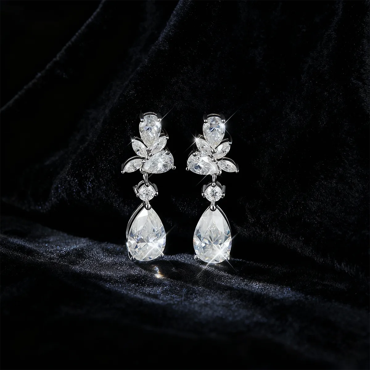 Vintage leaf and teardrop statement earrings with 11×7mm pear-cut moissanite, 925 sterling silver with 18K white gold plating.
