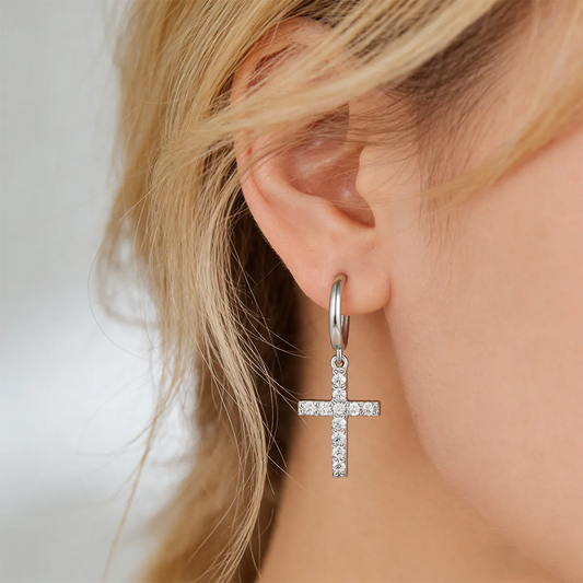 Symmetric pavé cross drop earrings made of sterling silver, set with 24×1.5mm moissanite stones on secure huggie hoops for lightweight daily wear.