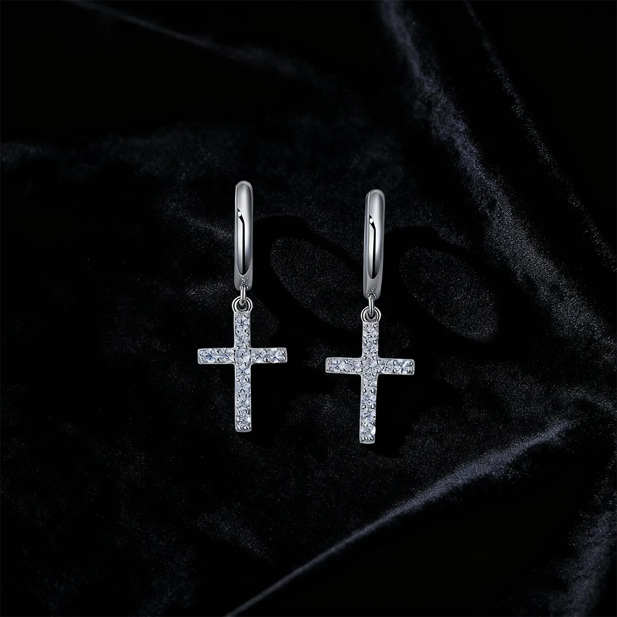 Symmetric pavé cross drop earrings made of sterling silver, set with 24×1.5mm moissanite stones on secure huggie hoops for lightweight daily wear.