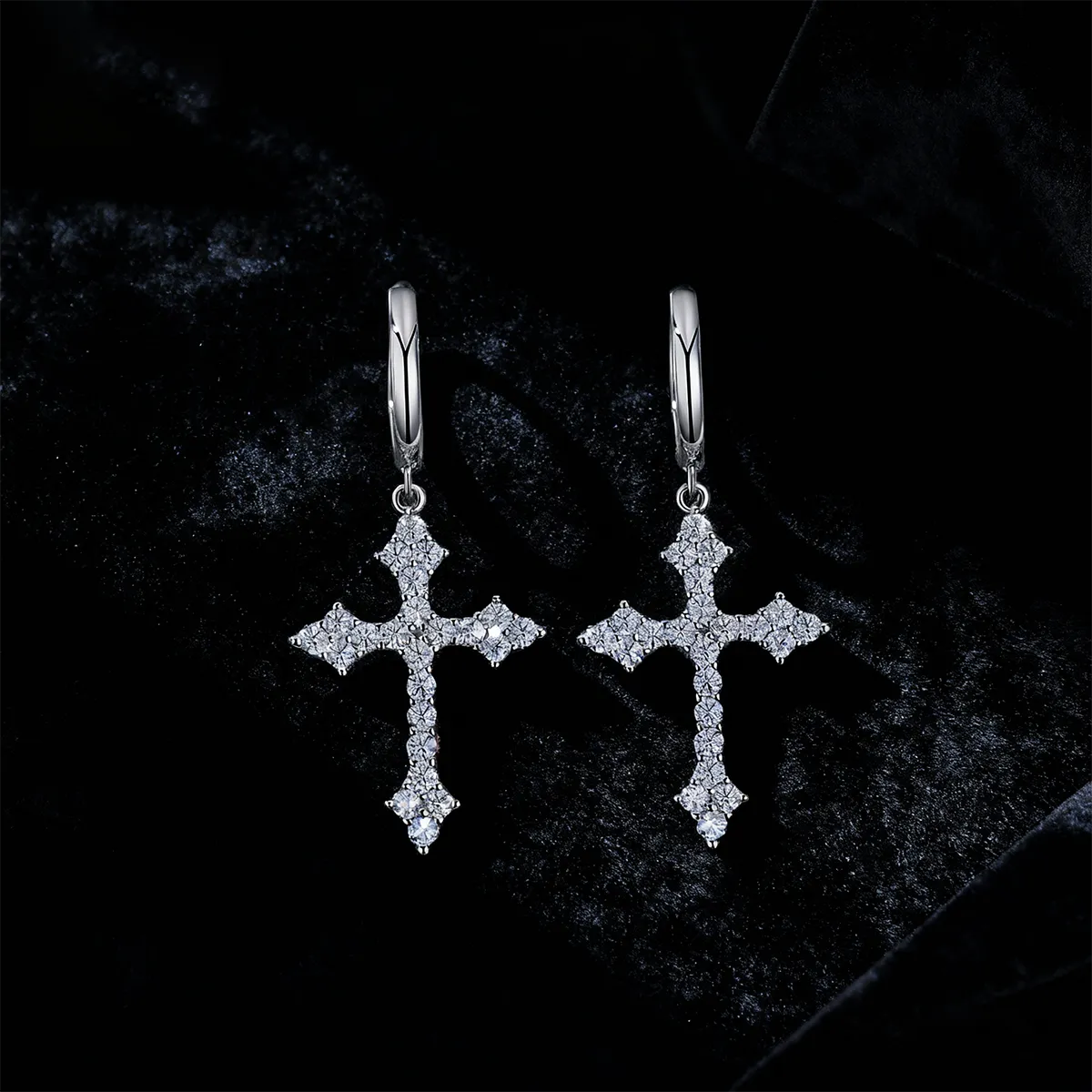 Ornate sterling silver huggie hoop earrings with floral clustered pavé cross drops set with 46 moissanite stones, designed for elegant religious celebrations.