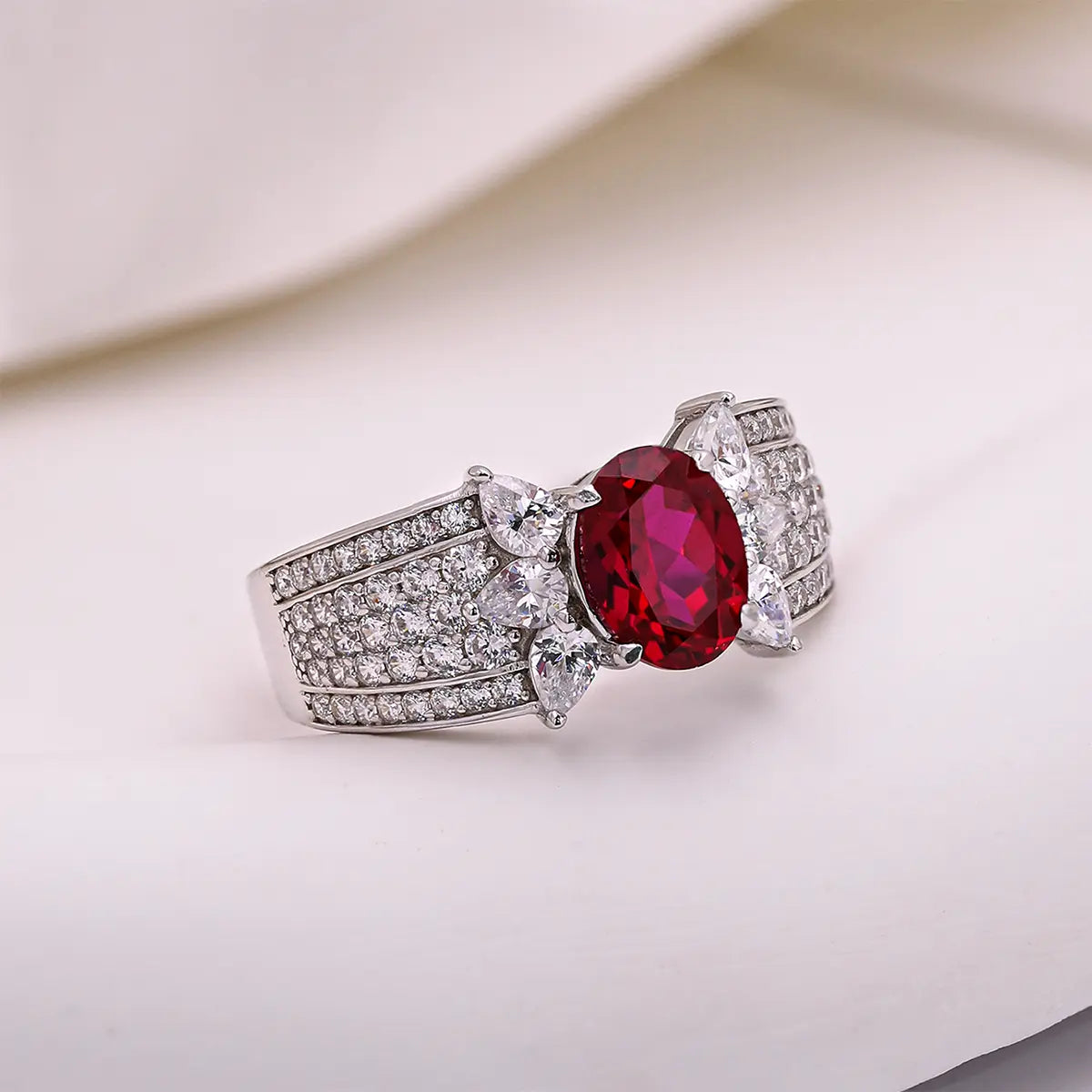 Romantic ruby promise ring with marquise CZ side stones, vintage design