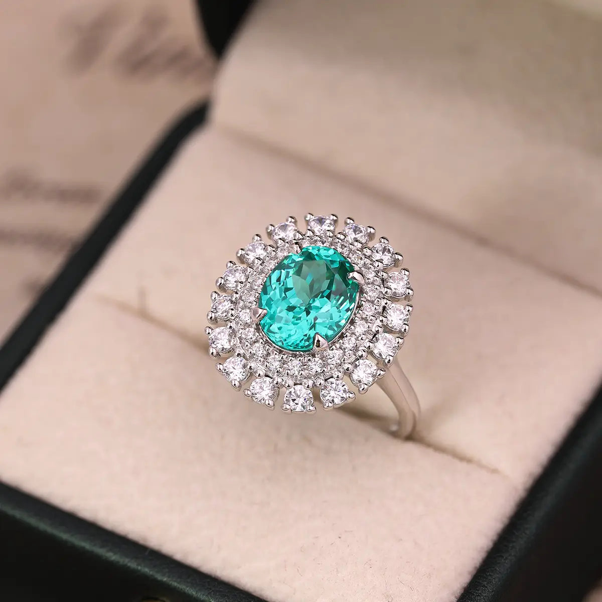 Emerald Whisper ring with 10x8mm oval Portuguese cut YAG Paraiba stone and cubic zirconia accents in sterling silver