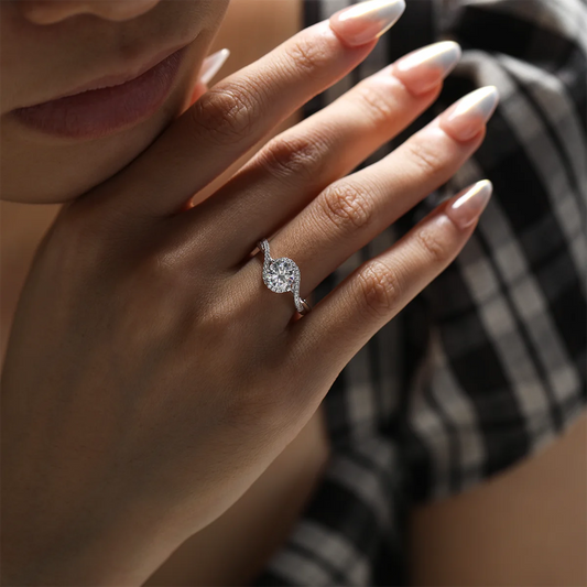 1ct round moissanite twisted band ring in 925 sterling silver with 18K white gold plating, elegant and modern engagement ring design.
