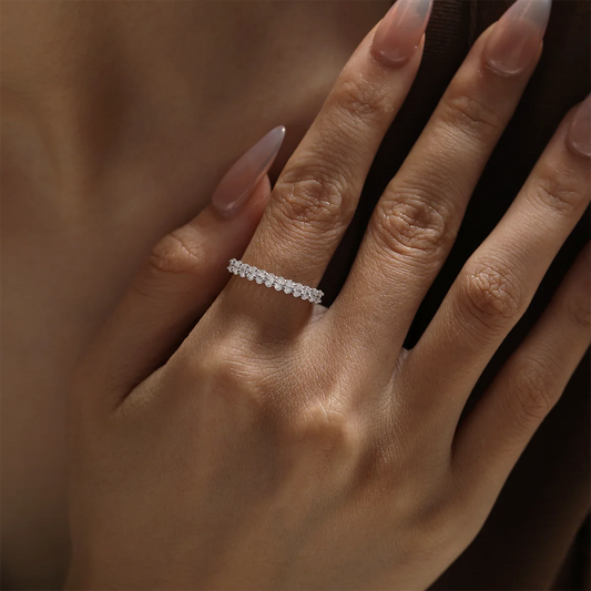 1.0ct Oval Moissanite Half Eternity Ring in 925 Sterling Silver with 18K White Gold Plating, featuring twelve oval-cut moissanites for timeless elegance.