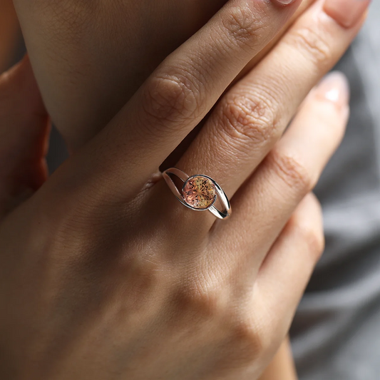 3.5ct Sunrise Orange Sapphire Ring featuring a nine-sided fancy-cut orange synthetic corundum set in 925 sterling silver with 18K white gold plating and a double-twisted band.