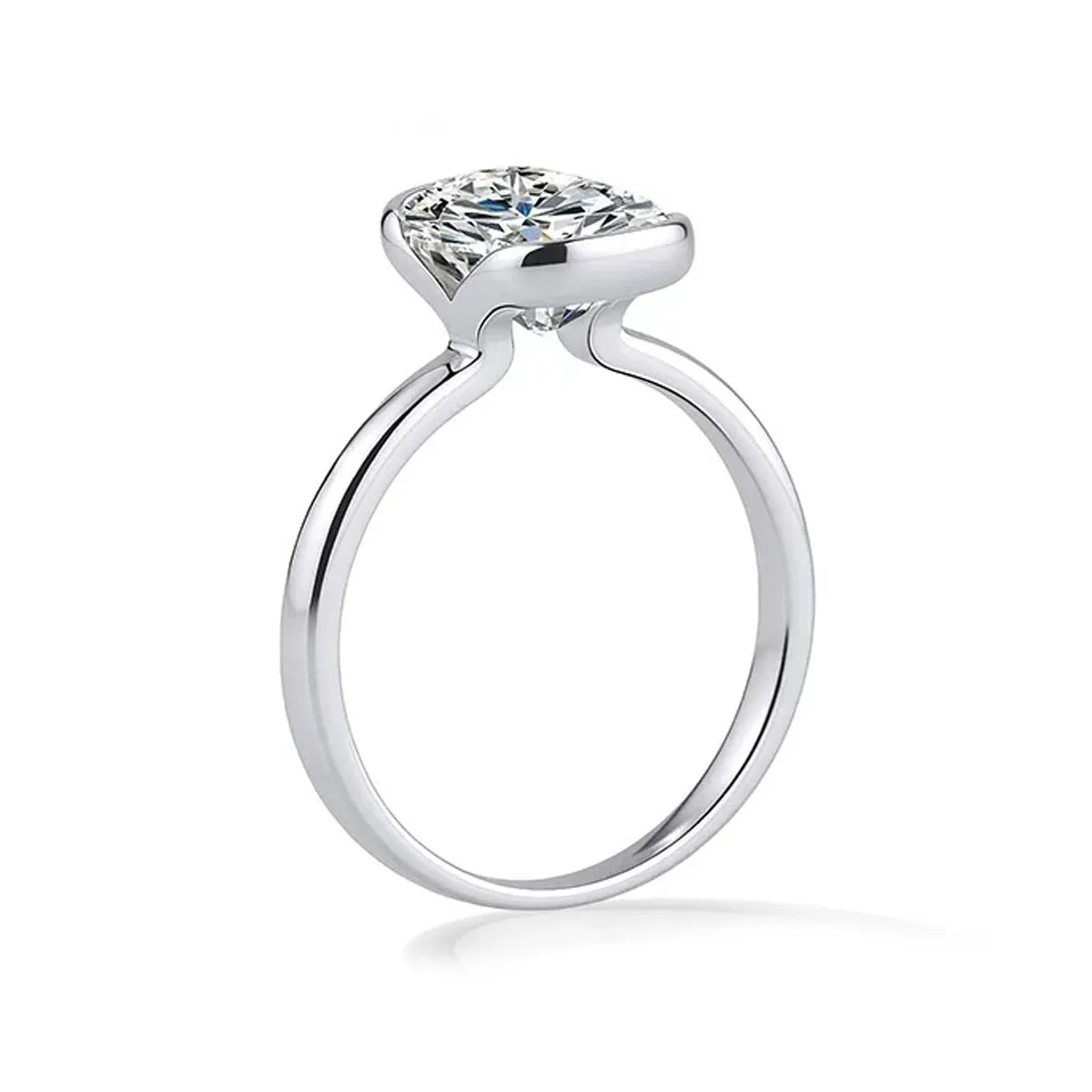 oval cut lab grown diamond bezel ring in 14k white gold