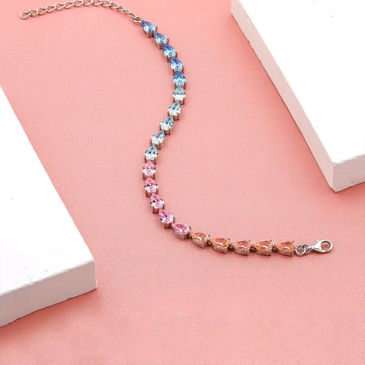 Colorful half pink half blue tennis bracelet with pear shaped gemstones