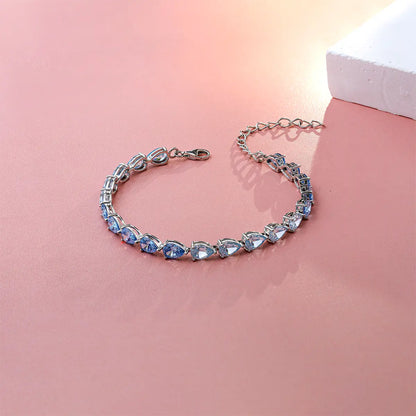 Blue gradient tennis bracelet with pear cut zirconia gemstones in sterling silver