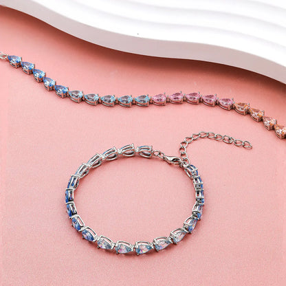 Blue gradient tennis bracelet with pear cut zirconia gemstones in sterling silver