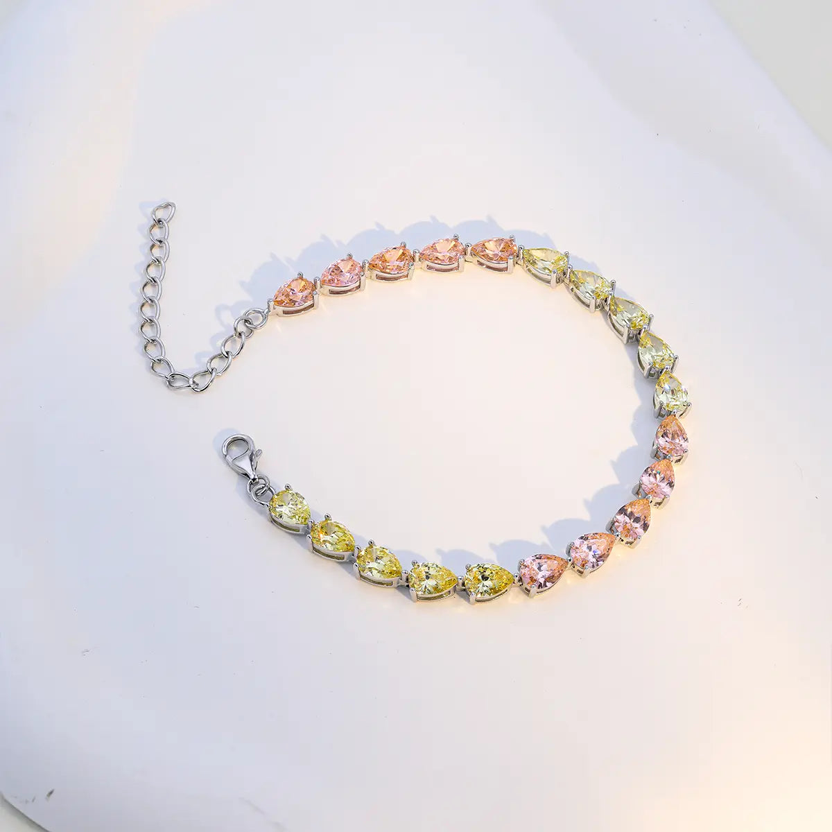Modern sterling silver tennis bracelet with pear cut multicolor zirconia gems