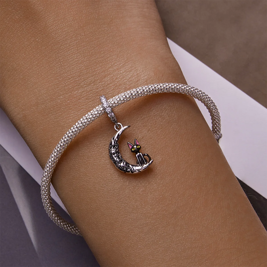Moon and black cat bracelet in silver with black gold and rose gold enamel charm.