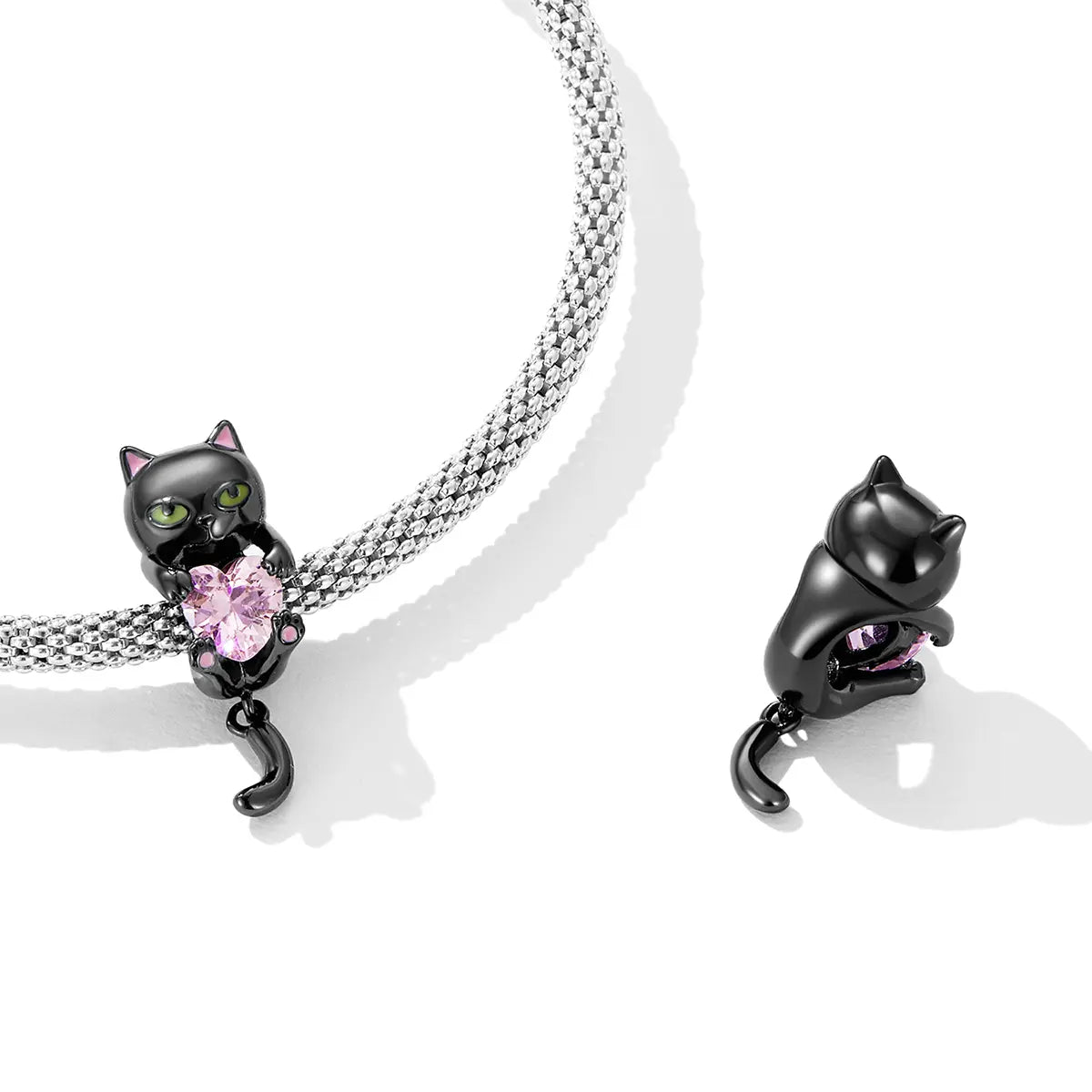 Black cat charm bracelet with enamel detail and cubic zirconia, crafted in sterling silver with black gold plating for Halloween style