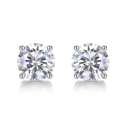 Round cut moissanite stud earrings in four-prong sterling silver setting, 6.5mm hypoallergenic design.