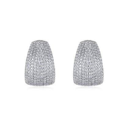 Sterling silver dome cuff stud earrings fully set with 1.5mm moissanite stones, creating a bold, full-pavé statement look with a comfortable curved fit.