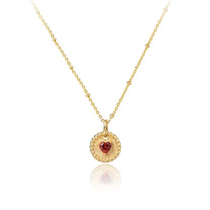 Elegant ruby double-heart necklace with brushed gold disc and starlit bead chain