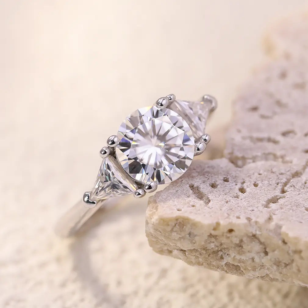 Shera Jewelry 2.6ct Round Cut Moissanite Ring Side View, Trillion Side Stones, 18K White Gold Plated Silver