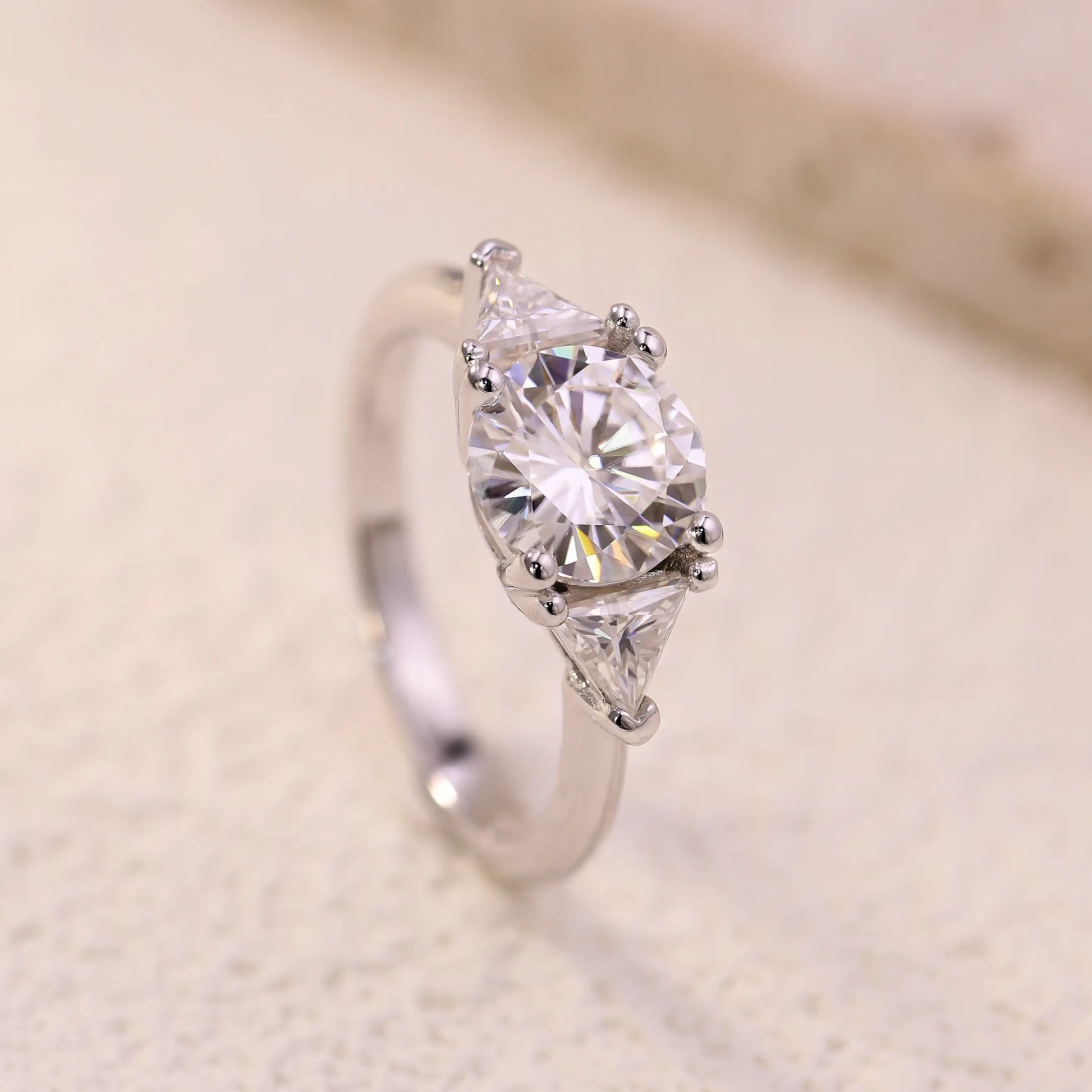 Shera Jewelry 2.6ct Round Cut Moissanite Ring Side View, Trillion Side Stones, 18K White Gold Plated Silver