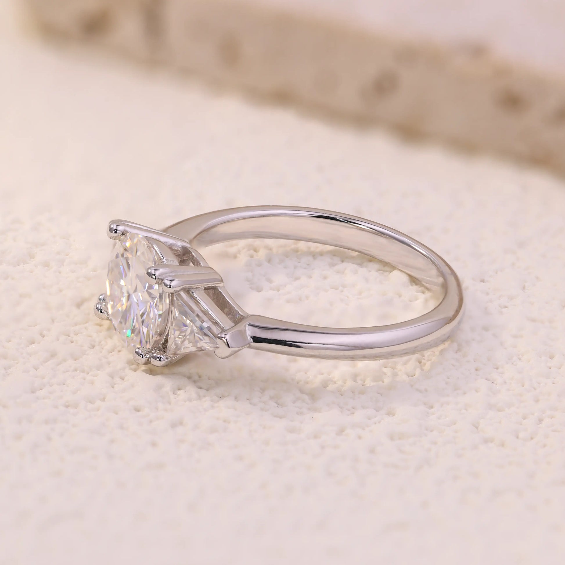 Shera Jewelry 2.6ct Round Cut Moissanite Ring Side View, Trillion Side Stones, 18K White Gold Plated Silver