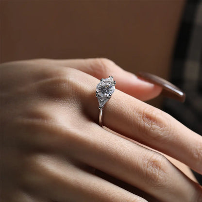 Shera Jewelry 2.6ct Round Cut Moissanite Ring Side View, Trillion Side Stones, 18K White Gold Plated Silver