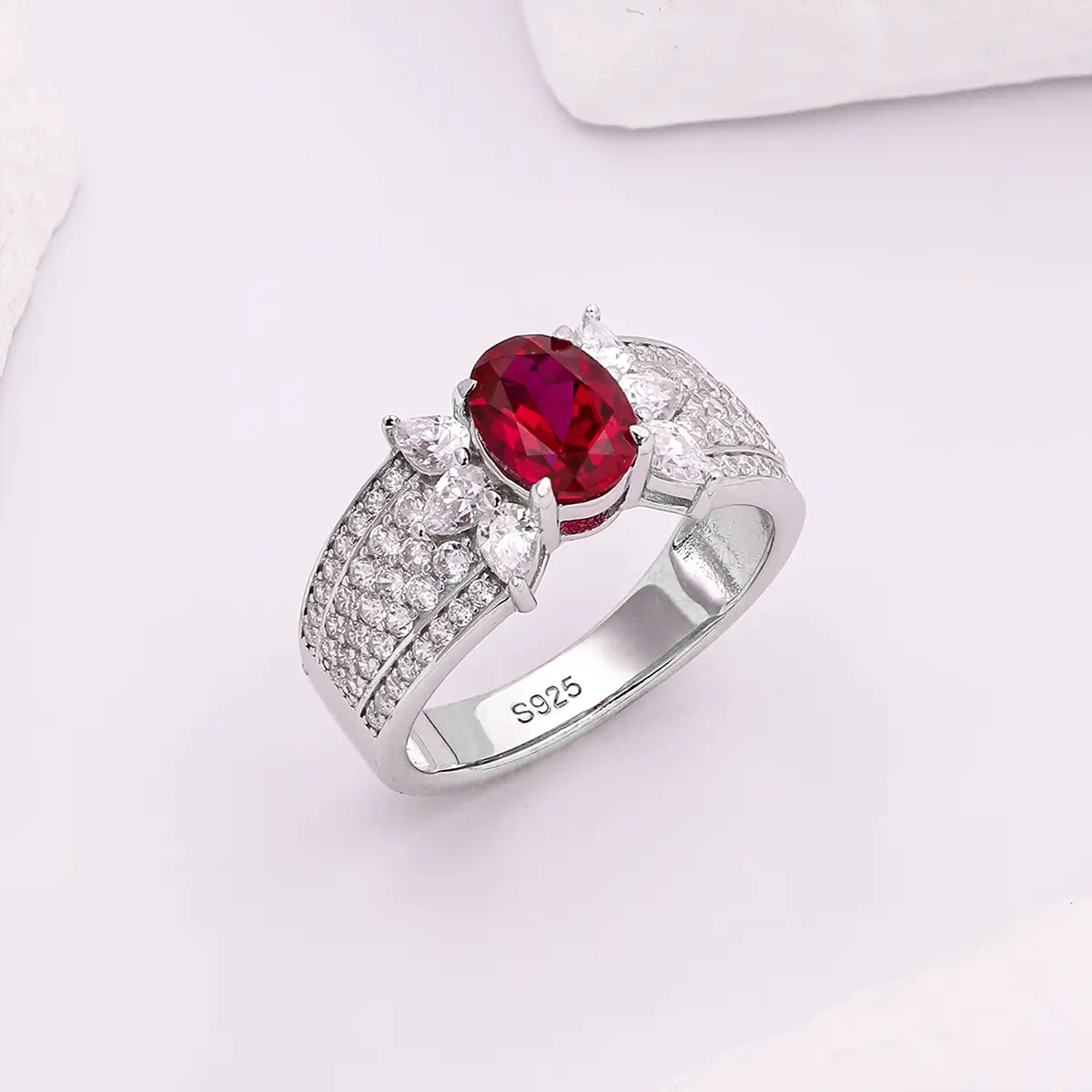 Romantic ruby promise ring with marquise CZ side stones, vintage design