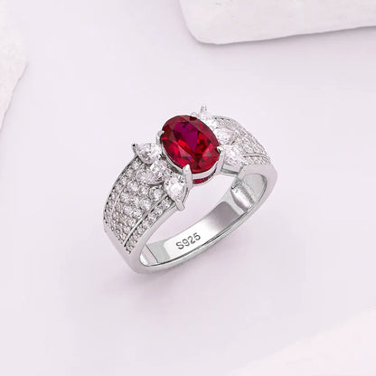 Romantic ruby promise ring with marquise CZ side stones, vintage design