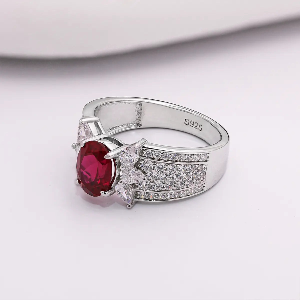 Romantic ruby promise ring with marquise CZ side stones, vintage design
