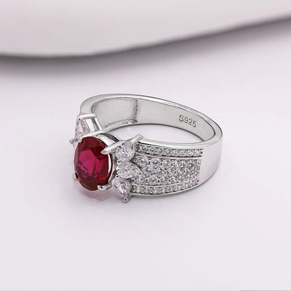 Romantic ruby promise ring with marquise CZ side stones, vintage design