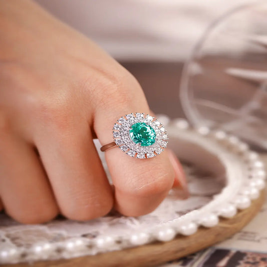 Emerald Whisper ring with 10x8mm oval Portuguese cut YAG Paraiba stone and cubic zirconia accents in sterling silver