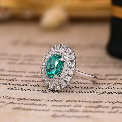 Emerald Whisper ring with 10x8mm oval Portuguese cut YAG Paraiba stone and cubic zirconia accents in sterling silver