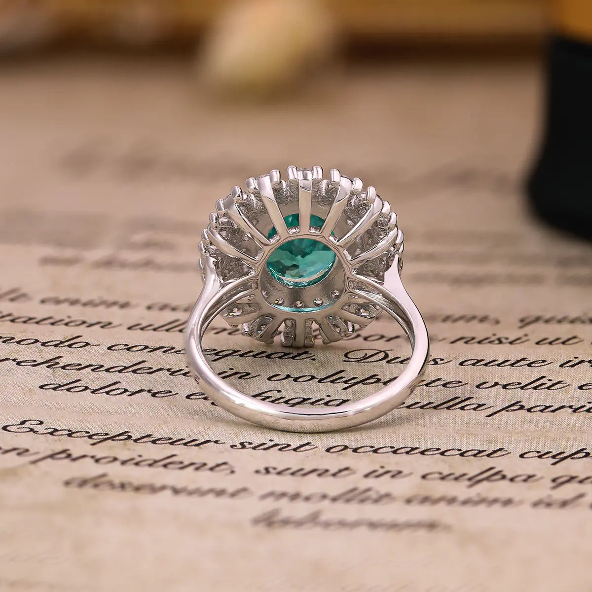 Emerald Whisper ring with 10x8mm oval Portuguese cut YAG Paraiba stone and cubic zirconia accents in sterling silver