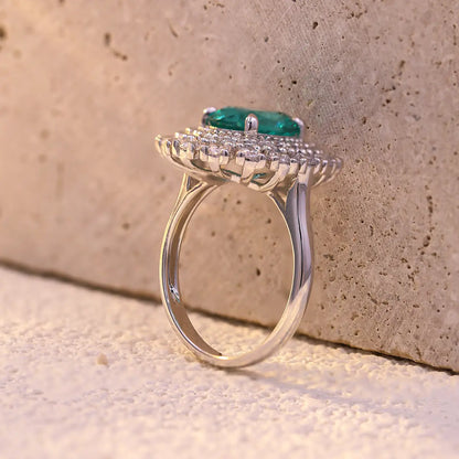 Emerald Whisper ring with 10x8mm oval Portuguese cut YAG Paraiba stone and cubic zirconia accents in sterling silver
