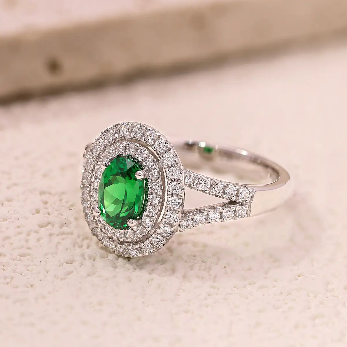 Sterling silver split shank ring with 1.35ct green YAG center stone and white CZ details