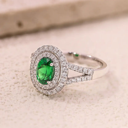 Sterling silver split shank ring with 1.35ct green YAG center stone and white CZ details