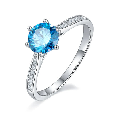 1ct Round Moissanite Heart-Prong Pave Ring in 925 Sterling Silver with 18K White Gold Plating, featuring heart-shaped six prongs and sparkling pave band.