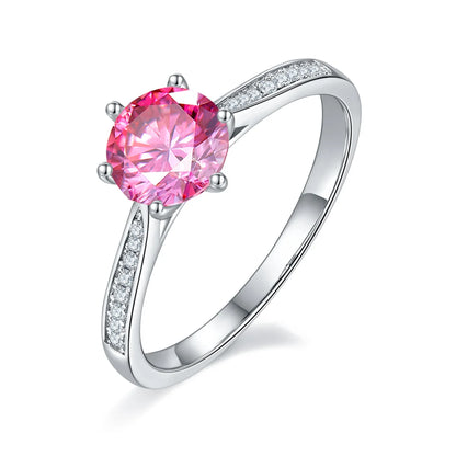 1ct Round Moissanite Heart-Prong Pave Ring in 925 Sterling Silver with 18K White Gold Plating, featuring heart-shaped six prongs and sparkling pave band.