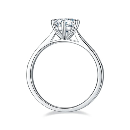 1ct Round Moissanite Heart-Prong Pave Ring in 925 Sterling Silver with 18K White Gold Plating, featuring heart-shaped six prongs and sparkling pave band.