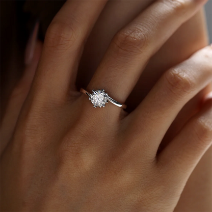 1 ct round moissanite twisted band ring in 925 silver with 18K white gold plating, six-prong setting, modern and elegant design.
