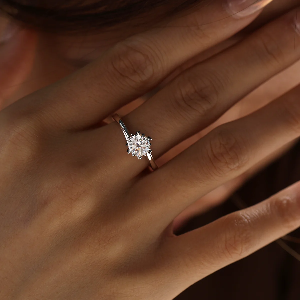 1 ct round moissanite twisted band ring in 925 silver with 18K white gold plating, six-prong setting, modern and elegant design.