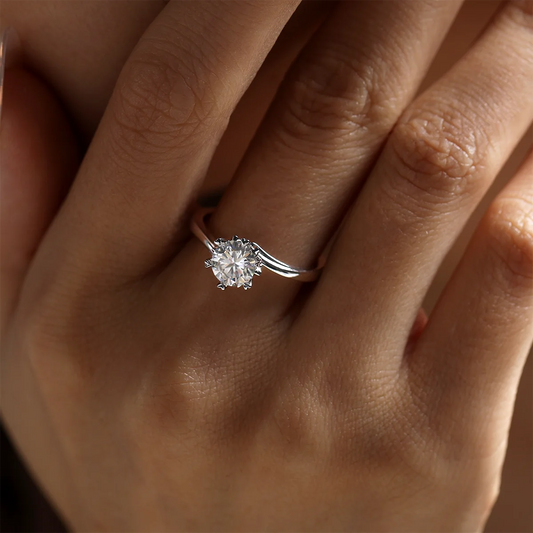 1 ct round moissanite twisted band ring in 925 silver with 18K white gold plating, six-prong setting, modern and elegant design.