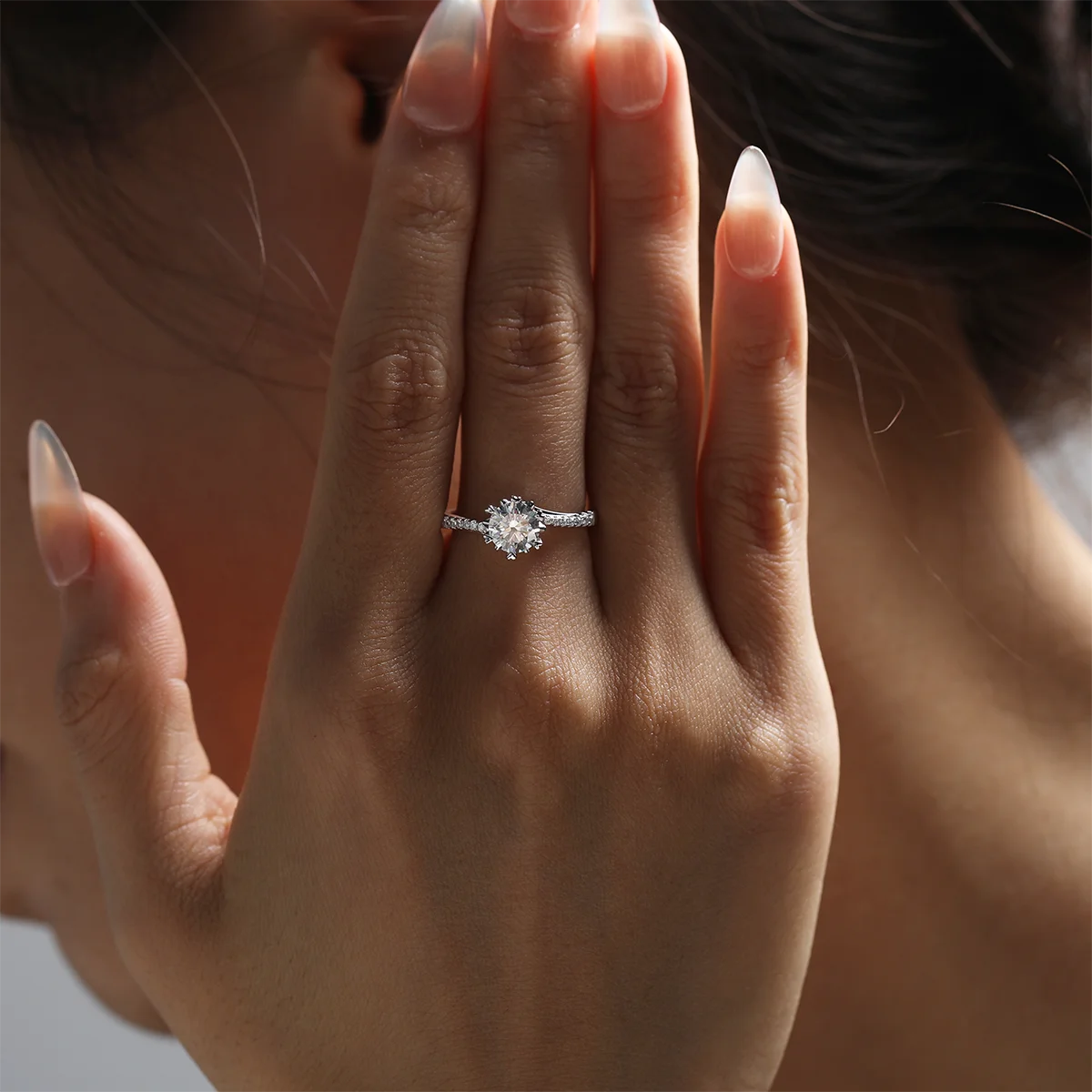 Round moissanite six-prong twisted band ring in silver, 1 carat center stone.