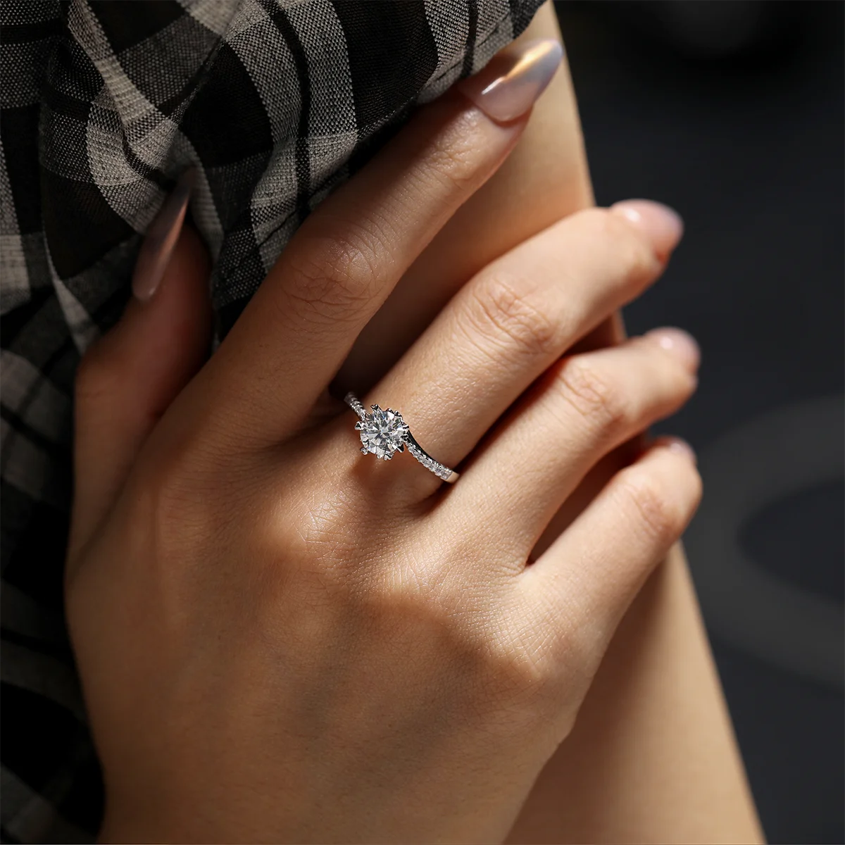 Round moissanite six-prong twisted band ring in silver, 1 carat center stone.