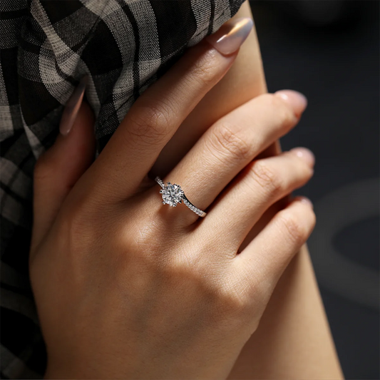 Round moissanite six-prong twisted band ring in silver, 1 carat center stone.