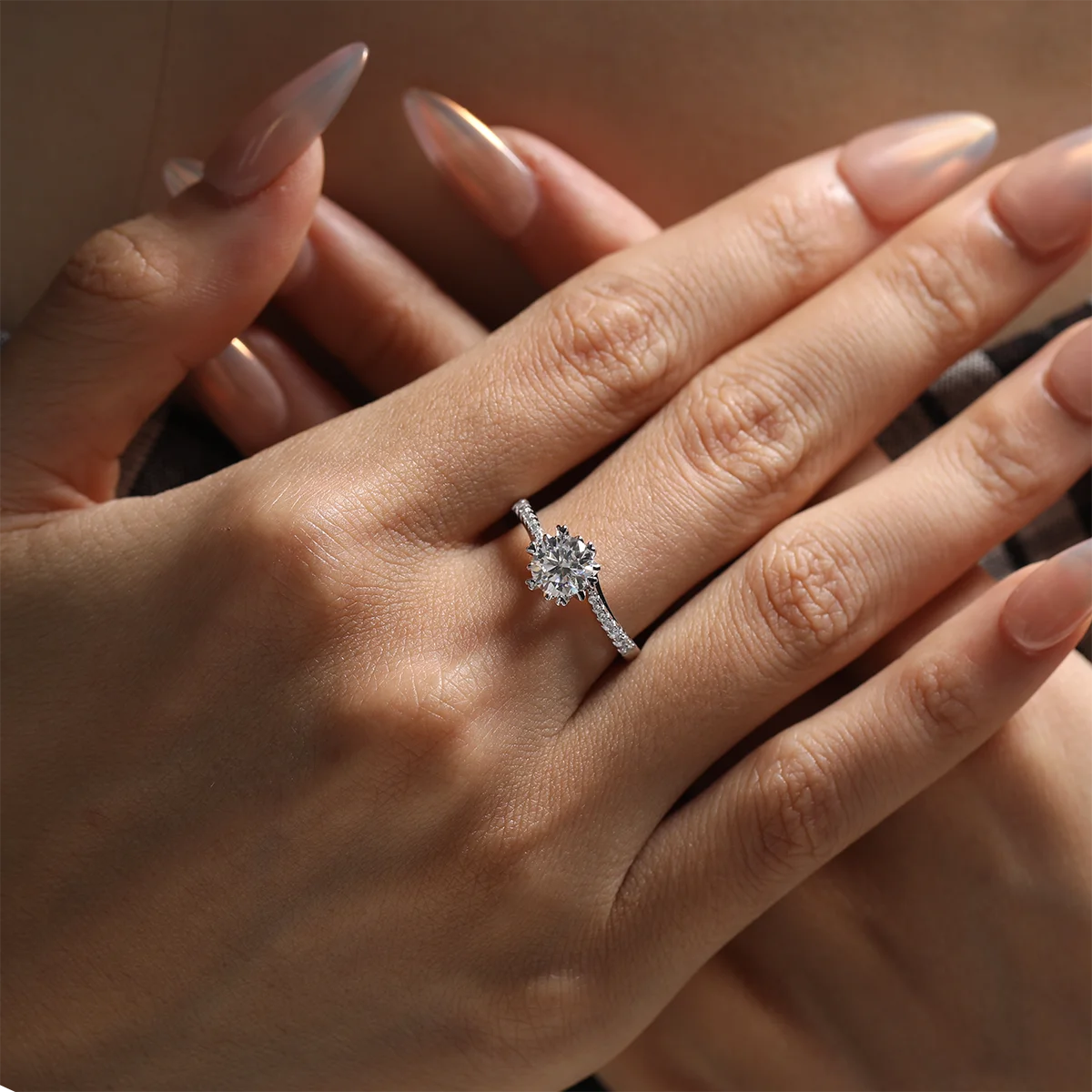 Round moissanite six-prong twisted band ring in silver, 1 carat center stone.