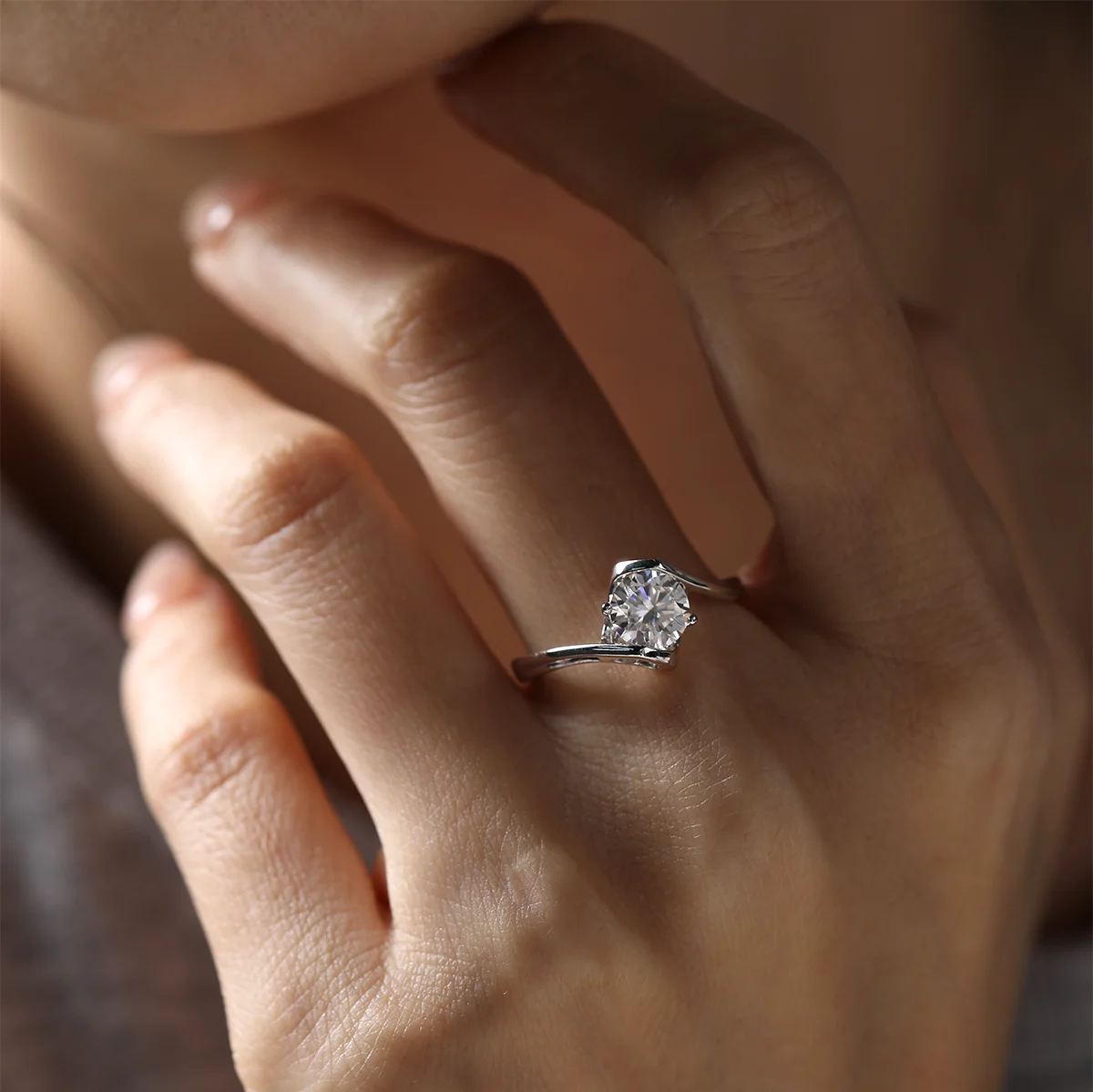 Angel wing twist moissanite ring, 1 carat center stone, sterling silver with white gold plating.