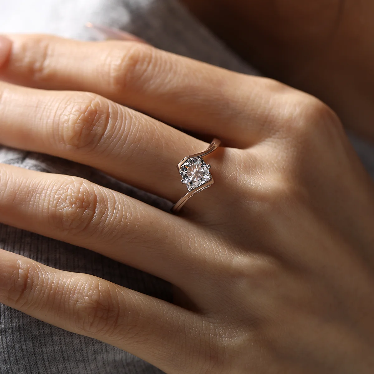 Angel wing twist moissanite ring, 1 carat center stone, sterling silver with white gold plating.